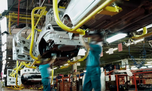 Overhead view of robotic and manual sealant/adhesive application on modern car production line – btektech complete systems