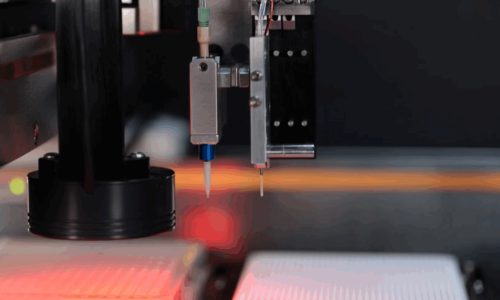 High-precision robotic dispensing station with vision guidance and multiple nozzles operating in an automated manufacturing environment