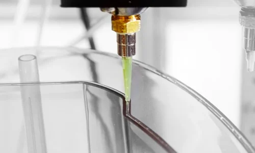 Automated nozzle dispensing a smooth, consistent bead of sealant along a curved edge