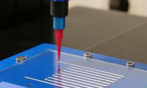 Automated dispensing system applying ultra-fine conformal coating lines on PCB test board